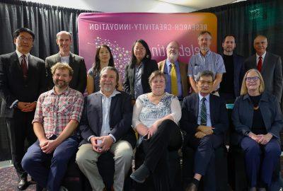 a group of people posing for a photo after winning awards.